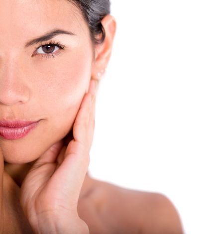 Close up on a woman's face- isolated over a white background