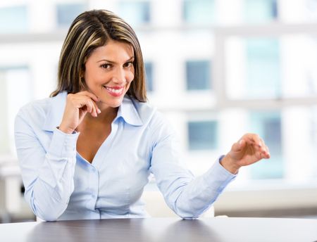 Businesswoman displaying something imaginary with her hand -