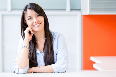 Sucessful business woman sitting in her desk