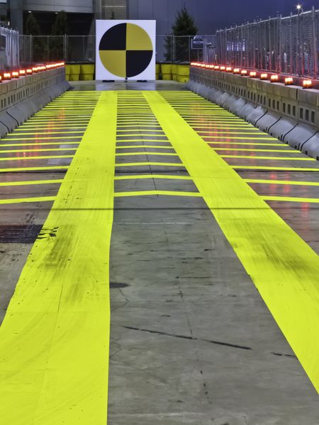 Straight and narrow and yellow -- indoor test track for attendees of auto show