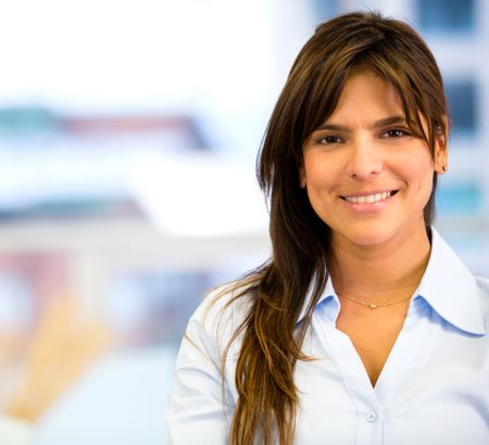 Beautiful business woman smiling at the office