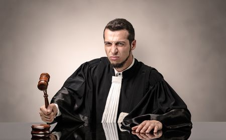 Young dashing judge in black gown making decision with no concept
