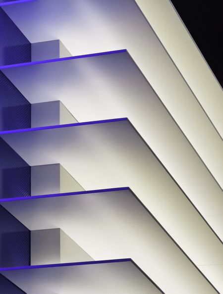 Interior symmetry in blue and white: decorative wall in convention center