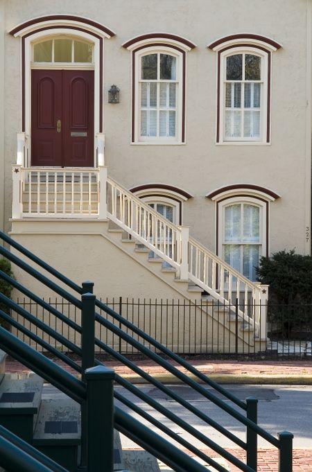 Stairways to dwellings separated by a narrow street in city neighborhood