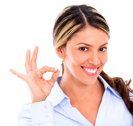 Business woman making an ok sign - isolated over white