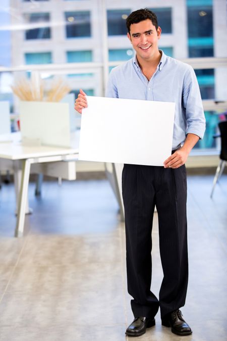 Businessman holding a banner at the office