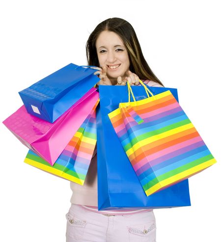 happy teen with her shopping over a white background
