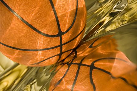 Sunlight playing on basketball and its reflection