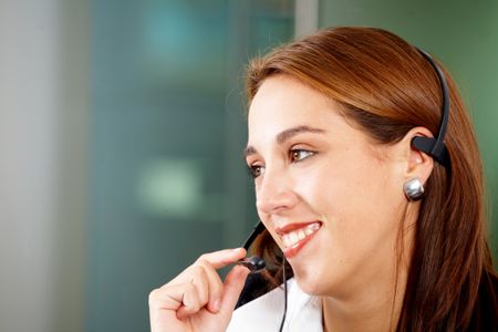 beautiful business customer service woman - smiling in an office