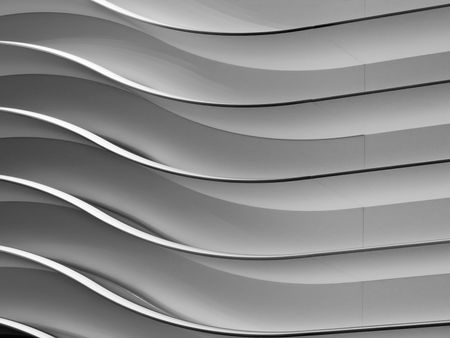 Abstract of interior design in black and white: Wavy wall at auto show in public convention center