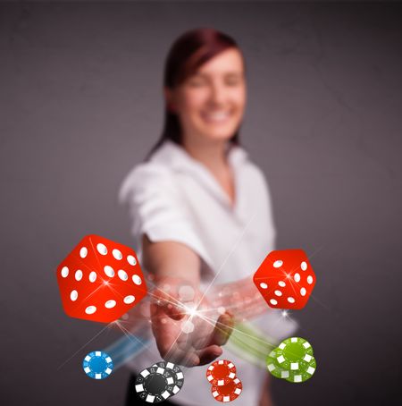 Pretty young woman throwing dices and chips