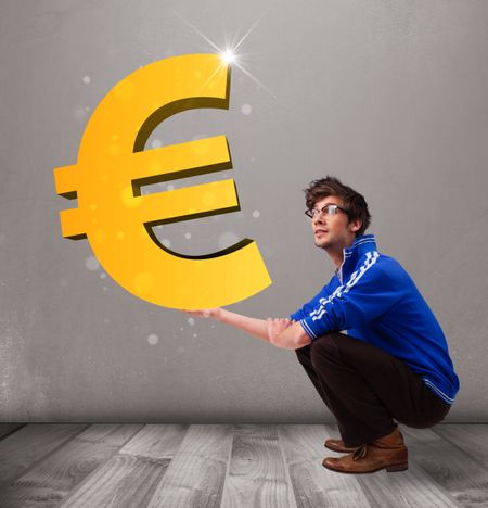 Good-looking young boy holding a big 3d gold euro sign