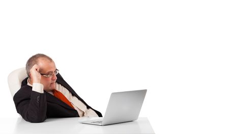 buisnessman sitting at desk and looking laptop with copy space, isolated on white