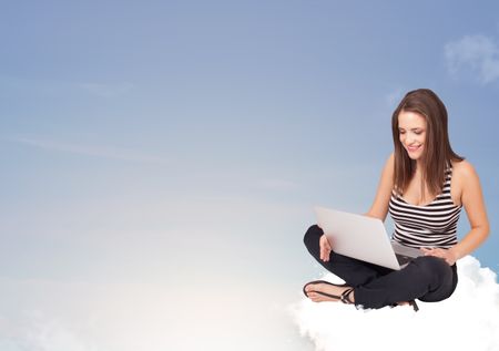 Beautiful young woman sitting on cloud with copy space