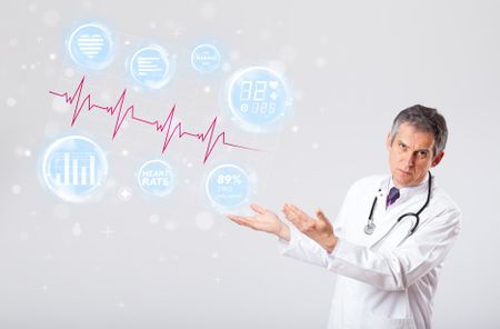 Clinical doctor examinating modern heartbeat graphics