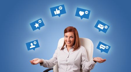 Young person playing with social media symbols