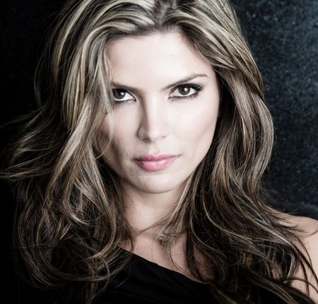 fashion-portrait-attractive-woman-dark-background-132178418 Fashion portrait of an attractive woman over dark background