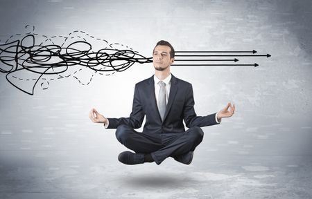 Businessman levitates in yoga position and systematize with thinking concept