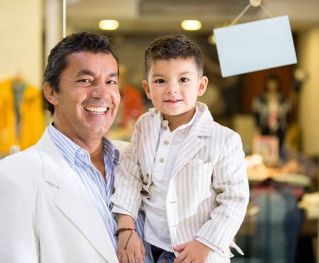 Father and son smiling at the shopping centre