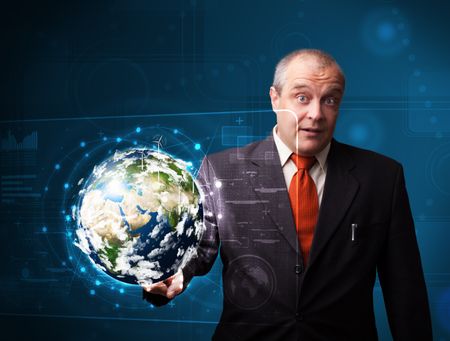 Businessman standing and touching high-tech 3d earth panel elements of this image furnished by NASA