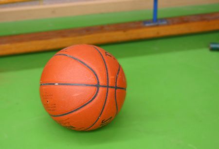 Basket ball on a green court
