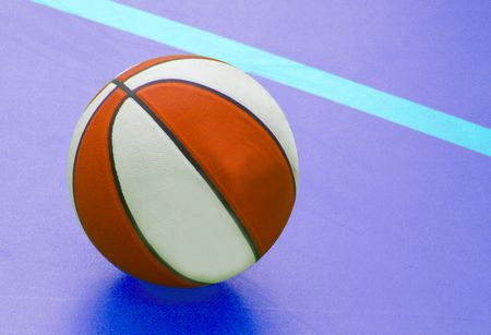 Basket ball on a blue court