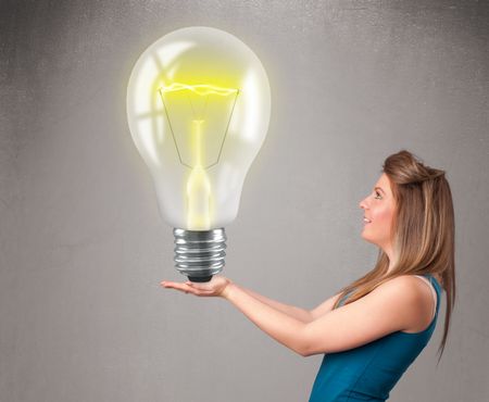 Beautiful young lady holding realistic 3d light bulb