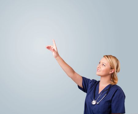 Pretty young female doctor gesturing with copy space