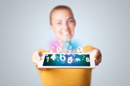 Beautiful young woman holding tablet with numbers