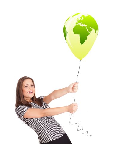 Happy young lady holding a green globe balloon