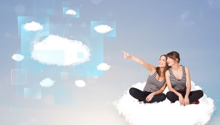 Happy young girls looking at modern cloud network