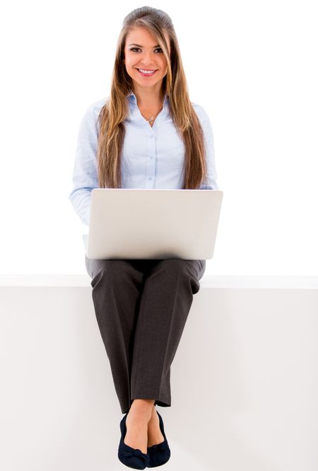 Business woman using a laptop - isolated over a white background