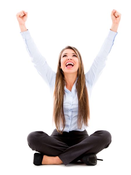 Excited business woman with arms up - isolated over a white background