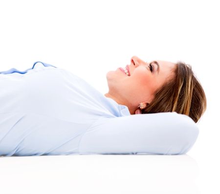 Business woman lying down daydreaming - isolated over white