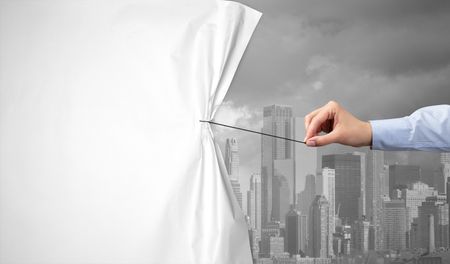 hand pulling green cityscape curtain to gray cityscape, environmental protection concept
