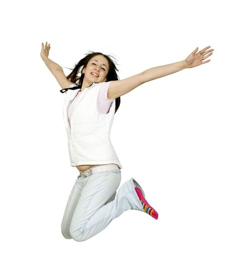 casual teen jumping of joy over white