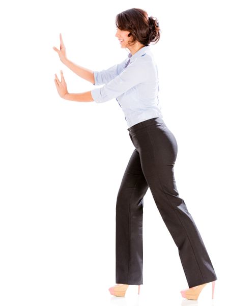 Business woman pushing with hands to the side - isolated over white