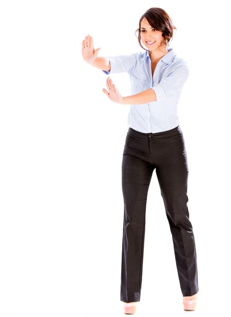 Business woman pushing an imaginary object - isolated over white