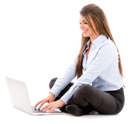 Business woman using a laptop computer - isolated over white