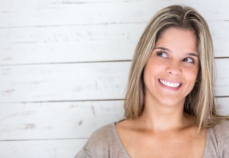 Portrait of a beautiful pensive woman looking very happy