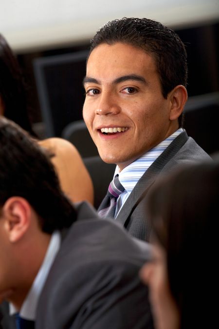 confident business man smiling in his office