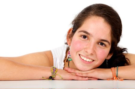 casual girl smiling leaning on a table isolated over a white background