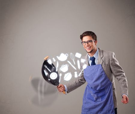 Handsome young man with kitchen accessories icons