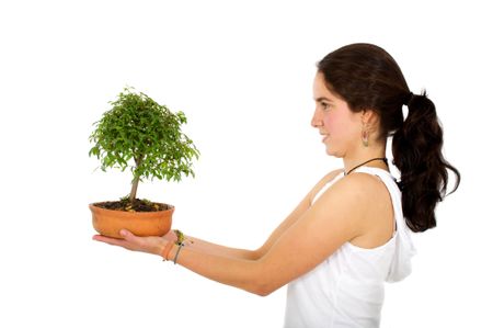 woman holding a newly born tree - over a white background