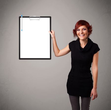 Beautiful young girl holding black folder with white sheet copy space