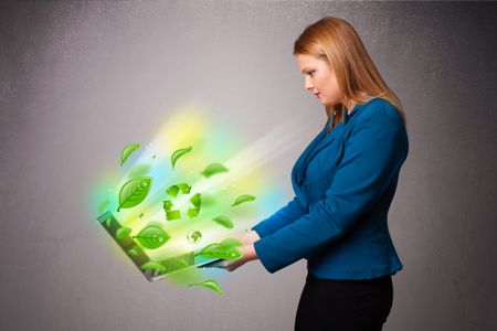 Casual young woman holding notebook with recycle and environmental symbols