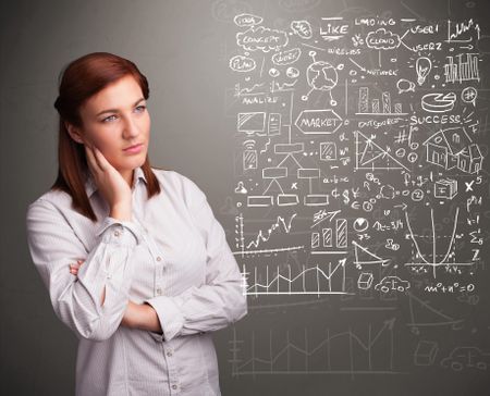 Pretty young woman looking at stock market graphs and symbols
