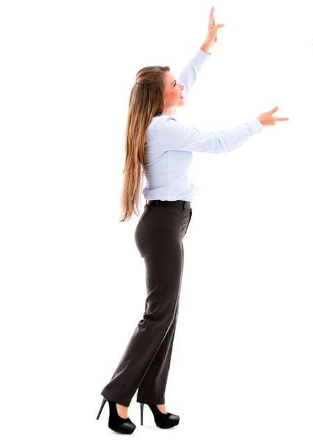 Business woman holding an imaginary object up. Isolated over white
