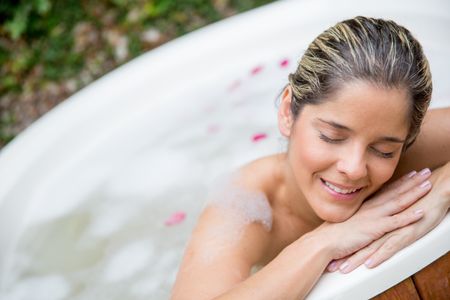portrait-beautiful-woman-enjoying-bath-tub-134845385 Portrait of beautiful woman enjoying a bath in a tub