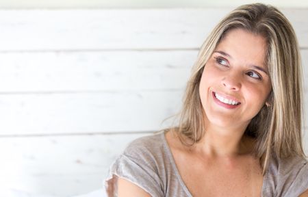 Portrait of a beautiful thoughtful woman smiling